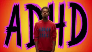 Foto van de rapper Typhoon met op de achtergrond grote letters ADHD.