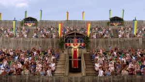 Foto van een amfitheater met vlaggen en versieringen met veel publiek als Romeinen verkleed.