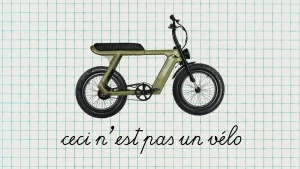 Afbeelding van fatbike op ruitjespapier met daaronder in het Frans de zin 'ceci n'est pas un vélo'.