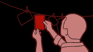 Een tekening van een man die analoge foto's aan het ontwikkelen is. Er hangen al drie foto's met wasknijpers aan een lijn, hij hangt er één bij. De kamer is donker.