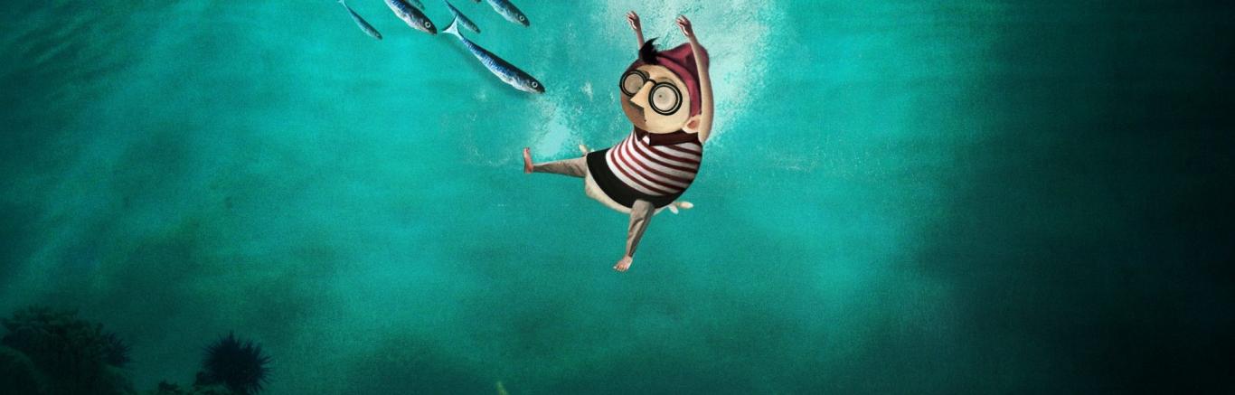 Animatiefiguur in de zee. Er komen vissen op hem afgezwommen.