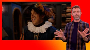 Pietje Paniek staat in het pakjesruim. Gebarentolk staat naast het scherm.